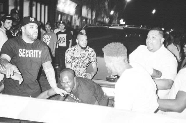 Michael Sapp, right foreground, faces a group of people after being knocked down during a fight outside the Charleston on June 14th. Photographer Sean O'Neill cautions against reading too much into the expression on the face of the man in the center. "I don’t know what that guy’s interaction was," he said.